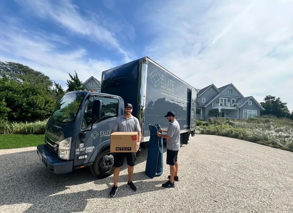 Elite Anywhere crew unloading a branded delivery truck