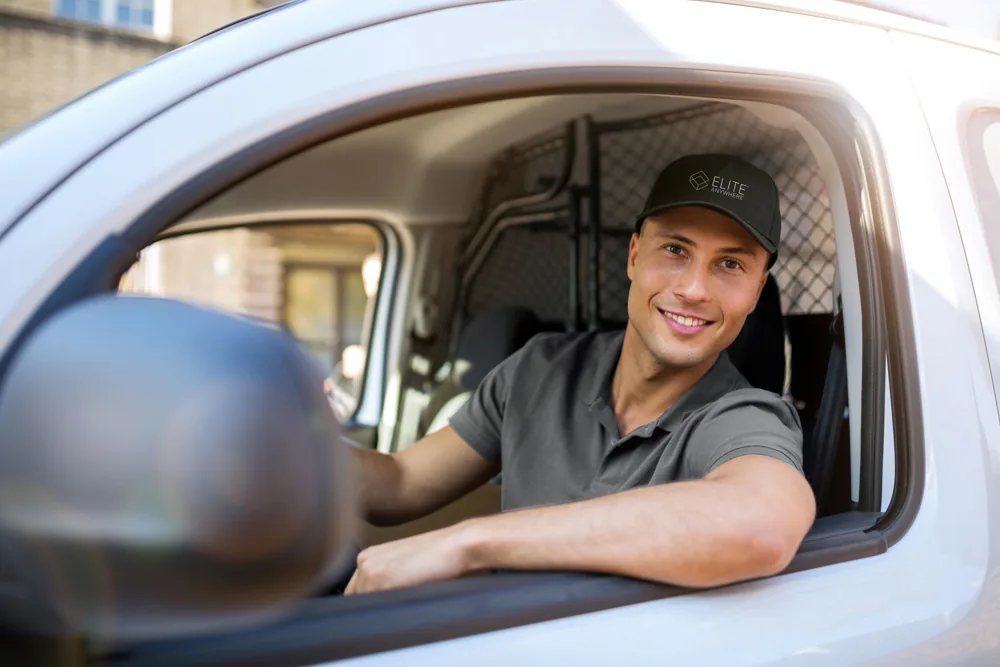 Friendly Elite Anywhere driver in the delivery van